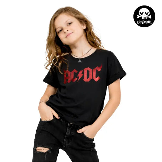 Young girl wearing a black Kids t-shirt with AC/DC Horns logo on a white background
