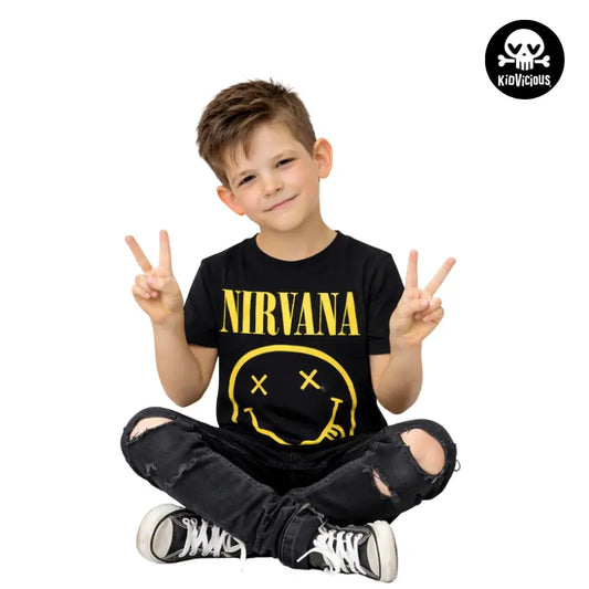 Cool Young Boy Sitting Down Wearng a Black Nirvana Smiley Kids T-shirt